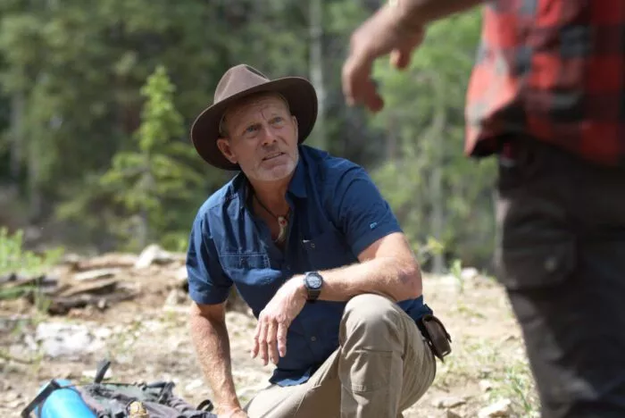 Eric Drummond looks up at Chad Ollinger at their campsite.
