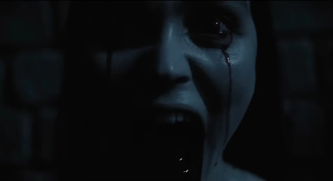 Ellen screaming with blood pouring from her eyes and mouth, from Focus Features' new movie, Nosferatu.