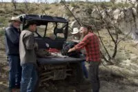 Out at the Bead Site bore hole, Chad Ollinger explains to Duane Ollinger, Josh Feldman and Charlie Snider how the acoustic homing beacon and hydrophones work