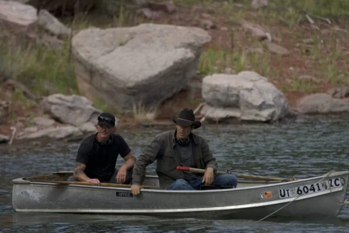 On the waters of Calamity Lake, Ryan Skinner and Josh Feldman patiently wait for Chad Ollinger (offscreen) to surface from the depths below