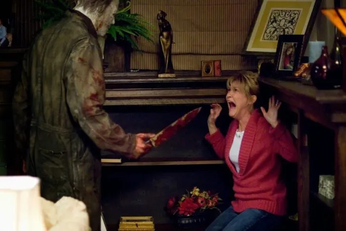 Dee Wallace as Mrs Strode being stalked by Michael Myers