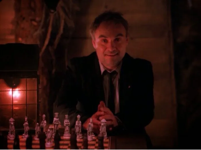 Windom Earle sitting at a chess board.