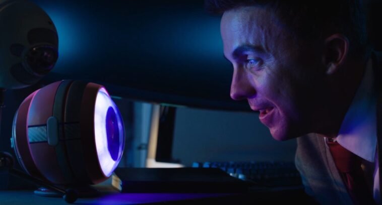 A man looks into a machine that looks like an eyeball in RENNER