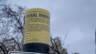A still shot of one of the illegal mining claim signs