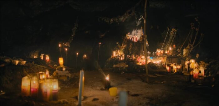 A cave filled with candles and bats holds a devil shrine