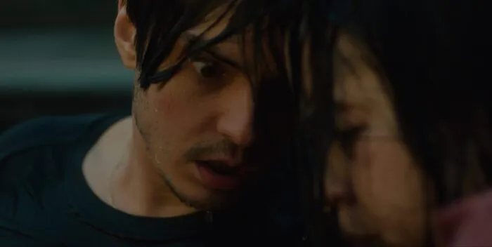 A soaking-wet man looks intensely at the woman he's pressing his forehead against in CONTROL FREAK