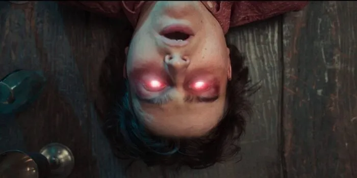 A man's head lying on the floor with lit up red eyes in GOTHIC SLAYERS