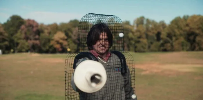 A man in a man-formed cage wields a metal tube like a sword in GOTHIC SLAYERS