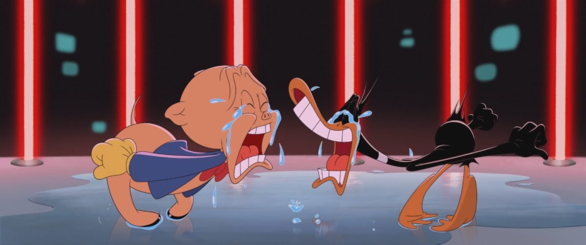 Porky Pig (Eric Bauza) and Daffy Duck (Eric Bauza) cry streams of tears while in a cage with lasers for bars, in the film, “The Day the Earth Blew Up” (2024).