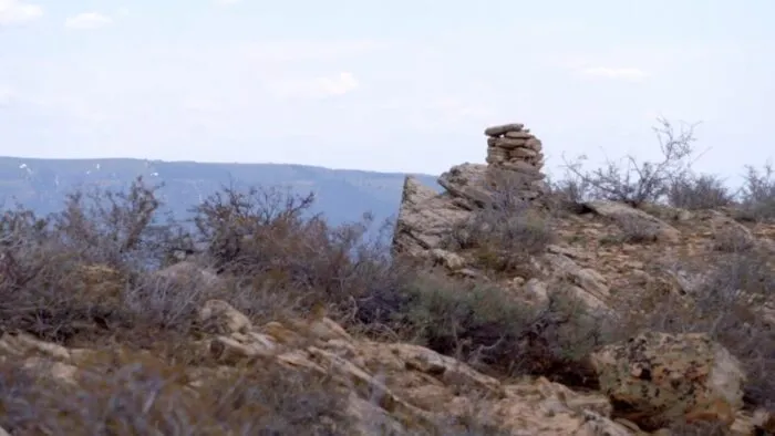 A cairn is placed upon the top of a ridgeline