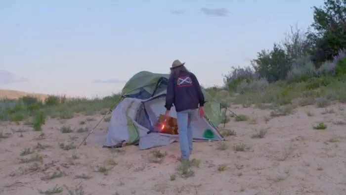 Duane lights a tent on fire with a flare