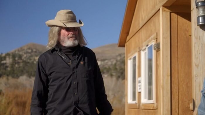 Duane stands next to the Miner's Shack