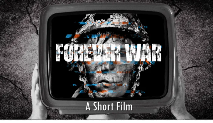 A person holds the edges of a television onto their head where their face is digitized by the display that reads FOREVER WAR