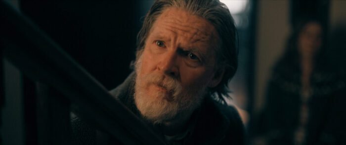 A concerned looking older man