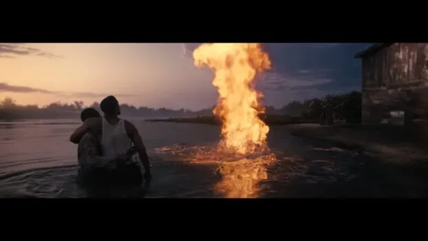 Smoke and Sammie watch as a column of fire ascends into the sky