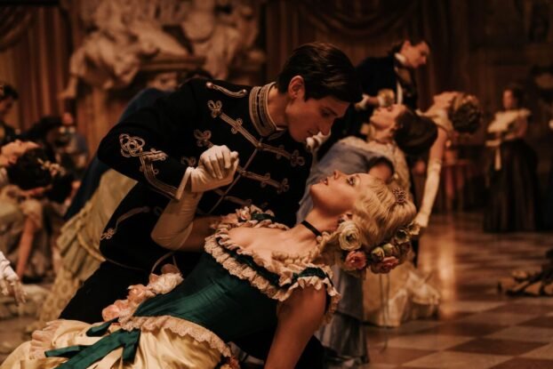 The Prince and Elvira at the Ball. The Prince is bowing Elvira down in his hands.