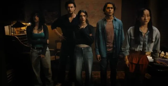 a group of shocked looking people stand together in UNTIL DAWN