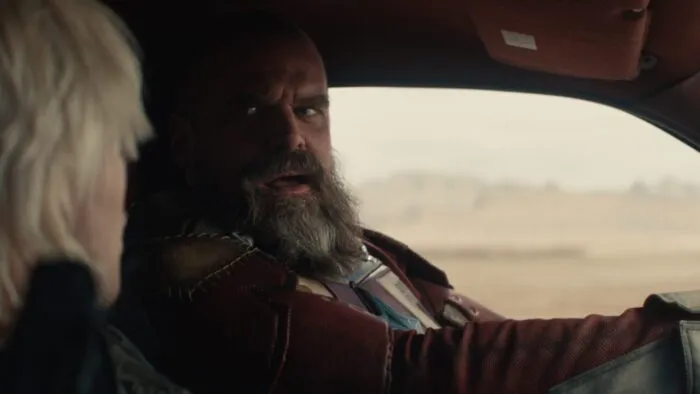 Alexei a.ka. The Red Guardian driving a car and speaking to Yelena.