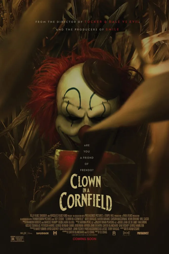 A person in a clown mask holding an axe is seen through cornstalks on the poster for Clown in a Cornfield.