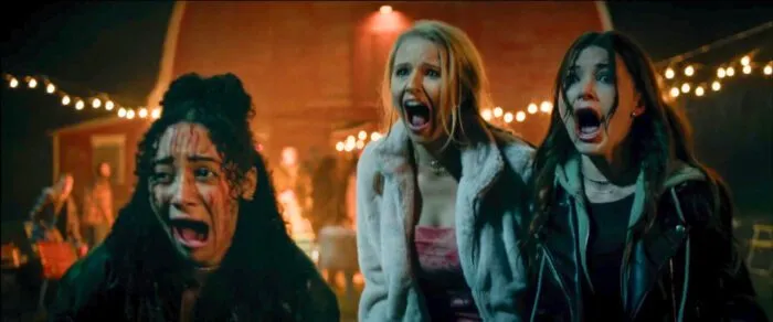 Three young women are seen screening