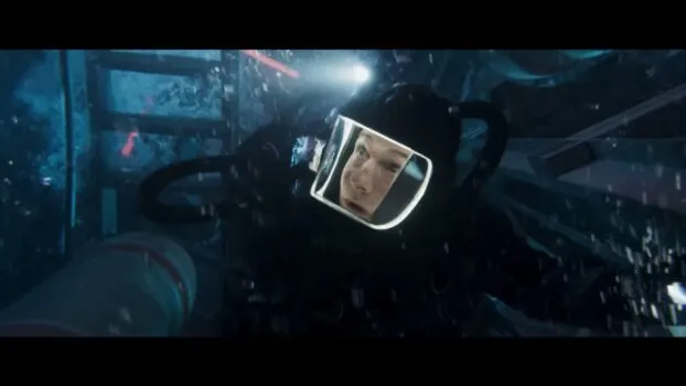 Ethan is underwater in the submarine, with a full diving suit on.