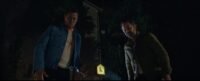 two men stand in the dark looking down toward the camera (I DON'T UNDERSTAND YOU)