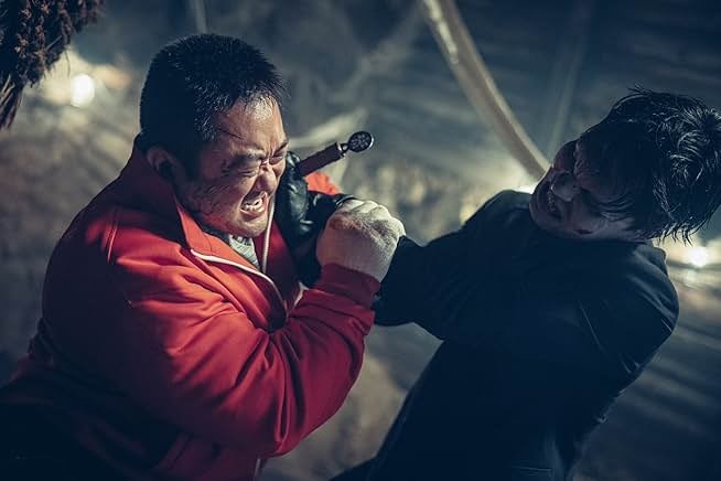 A man in a red jacket is being attacked by a demon in a black suit in HOLY NIGHT: DEMON HUNTERS
