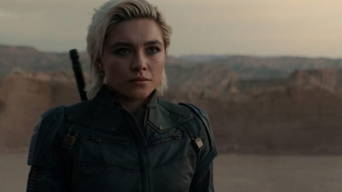 Yelena in the desert looking at the camera