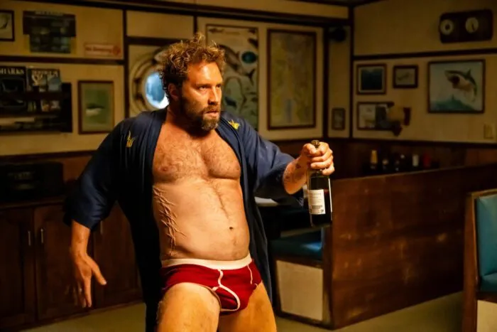 Bruce Tucker dancing with a bottle of alcohol in his underwear