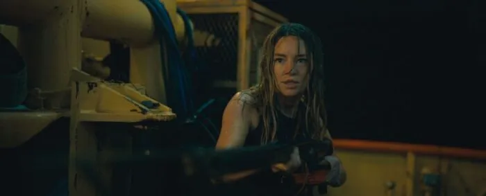 A woman carefully aims a spear gun in DANGEROUS ANIMALS