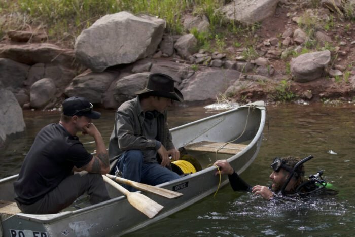 On the waters of Calamity Lake, Chad Ollinger tells Ryan Skinner and Josh Feldman about the potential cave opening that he discovered some 30 plus feet below the surface of the water