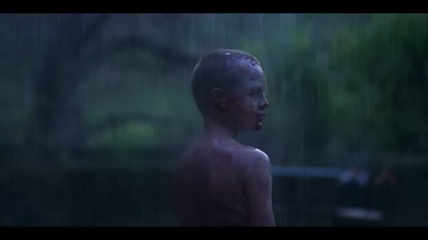 Ollie, a young boy, in the rain