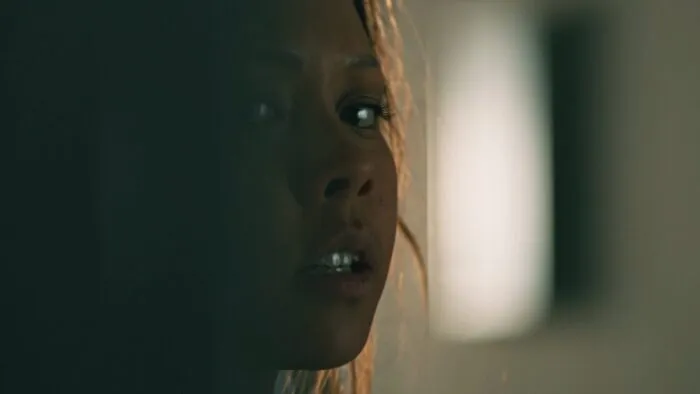 A closeup of a scared woman's face