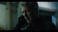 A man speaking on a telephone (AMONGST THE WOLVES)