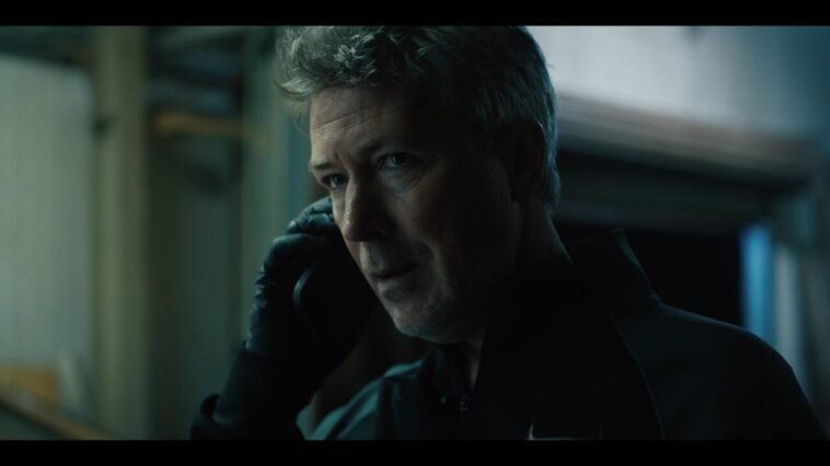 A man speaking on a telephone (AMONGST THE WOLVES)