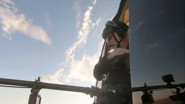 Technologist Pete Kelsey gets into Cameron's helicopter