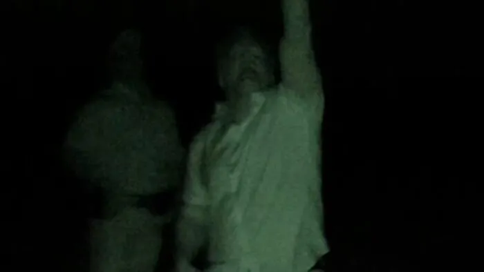 Travis looks up toward the sky (The Secret of Skinwalker Ranch: Bursting the Bubble)