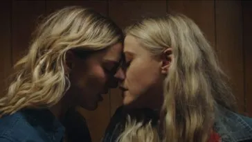 Two women rest their foreheads against one another in Abigail Before Beatrice