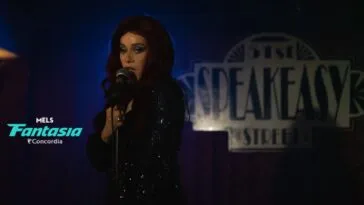 A woman sings on stage in front of a blue curtain and giant speakeasy sign (Every Heavy Thing)