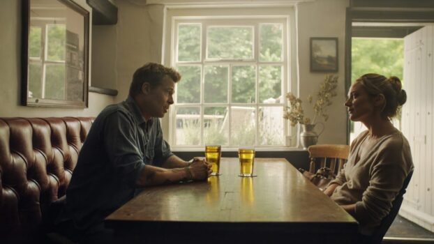 Sonny Hayes sits across the table from Kate on a date