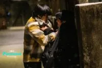 Two young men fighting underneath a street lamp (Fragment)