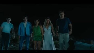 The five main friends, looking over the cliff at the wrecked car