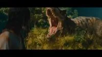 A woman faces a T-Rex roaring at her in the grass