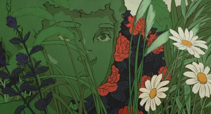 a young girl blends in with the shrubbery