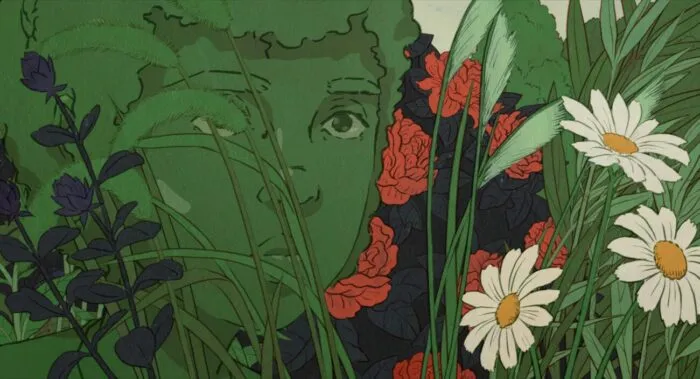 a young girl blends in with the shrubbery