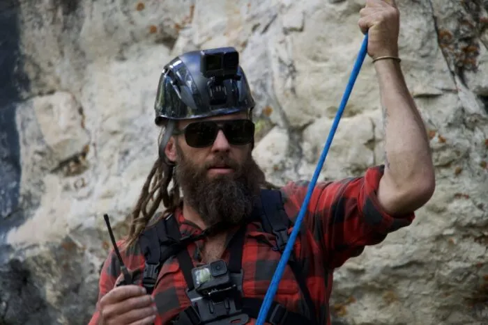 Chad Ollinger walkies the team above to help him up from the bottom of the escarpment, out near the Open Pit Mine. (Blind Frog Ranch: Drain The Pond!)