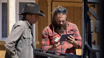 Outside of the Miner's Shack, Chad Ollinger loads surveillance footage of the intruder to show Josh Feldman.