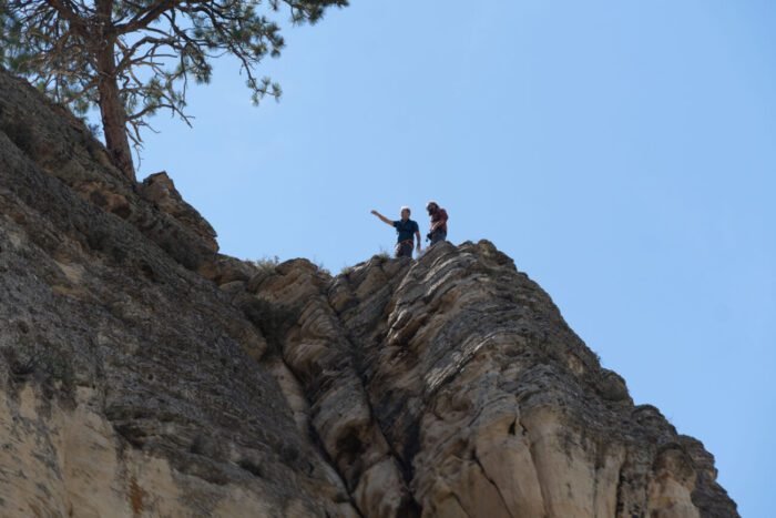 Eric and Chad are at the top of the cliff above the bat cave holes