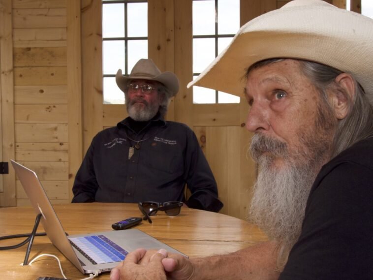 Duane Ollinger and Charlie Snider puzzle over security video of an unknown intruder to the ranch.