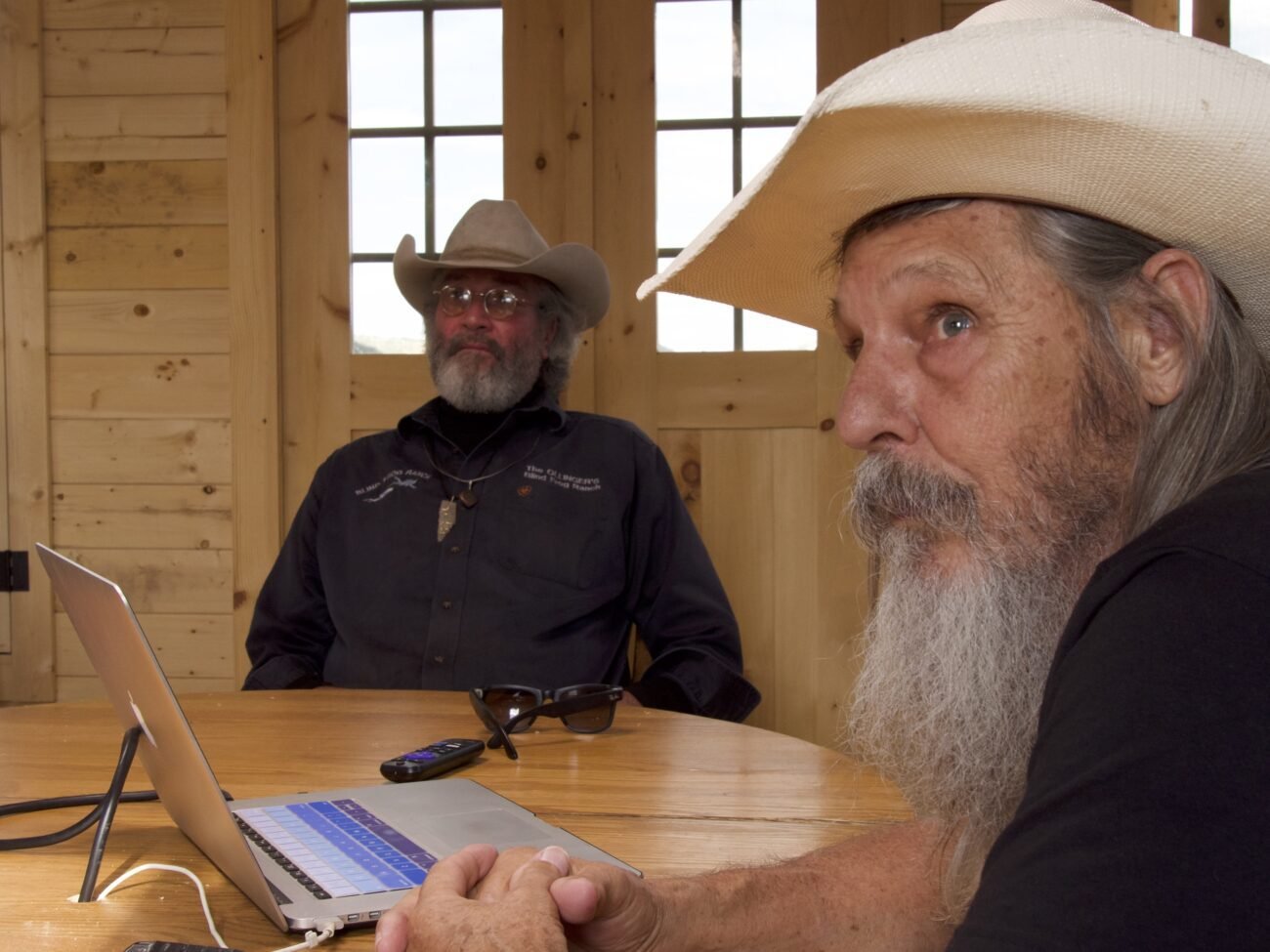 Duane Ollinger and Charlie Snider puzzle over security video of an unknown intruder to the ranch.